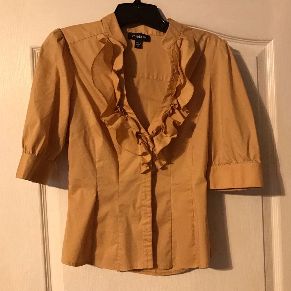 Ruffle front button up shirt from Bebe is size S.